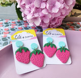 Strawberries with pastel blue acrylic stud tops