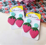 Strawberries with pastel blue acrylic stud tops